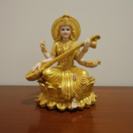 Golden Saraswati Idol – Goddess of Wisdom, Arts & Music (Sitting on Lotus)
